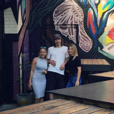 Parker Schnabel and Ashley Youle took a picture with their friend at The Budgie Bar.